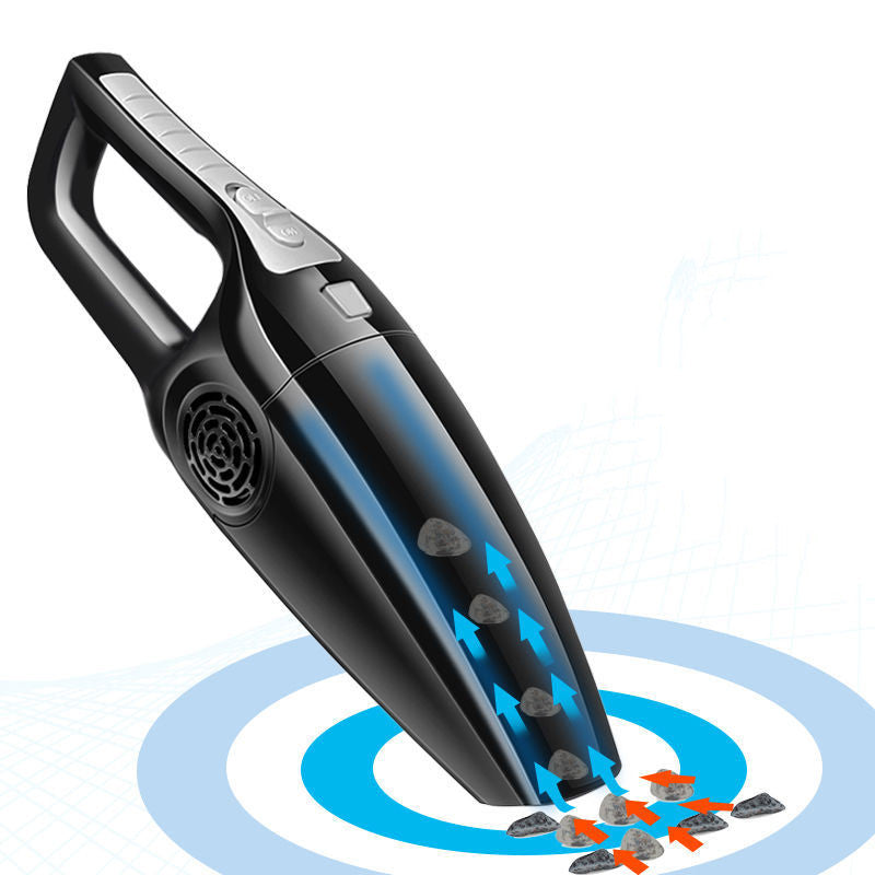 Black wireless handheld vacuum cleaner with silver buttons, suctioning small debris against a white background.