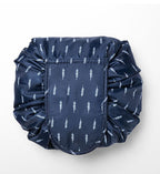Navy blue drawstring cosmetic bag with a white leaf print pattern, made of smooth, durable fabric.