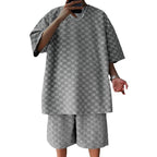 Grey jacquard checkered loose shorts and t-shirt set with a textured, boxy fit for a casual, streetwear look.