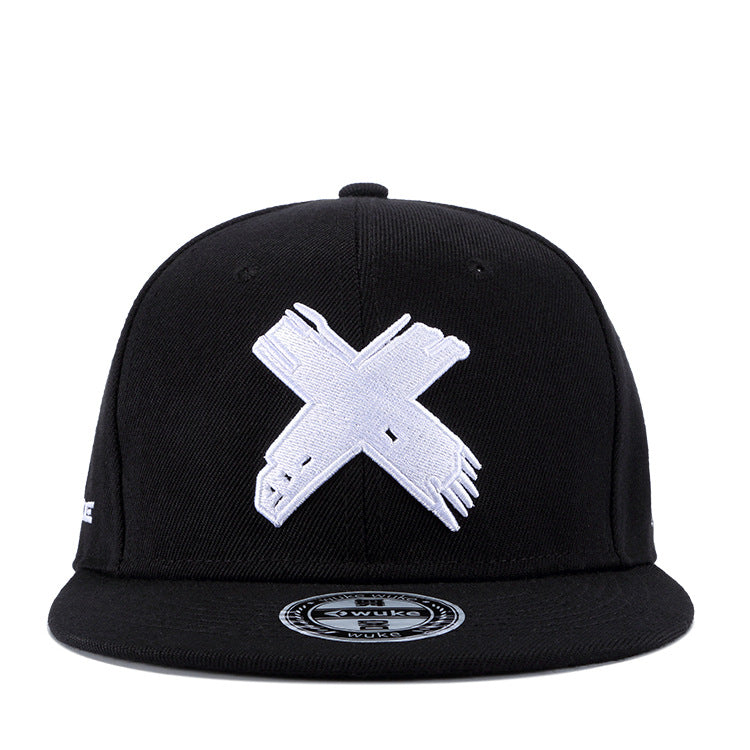 Black flat-brim hip hop cap featuring a large, distressed white embroidered 'X' logo on the front.