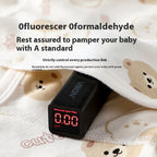 Class A cotton baby romper with bear print being tested by a fluorescent agent meter reading 0.00.