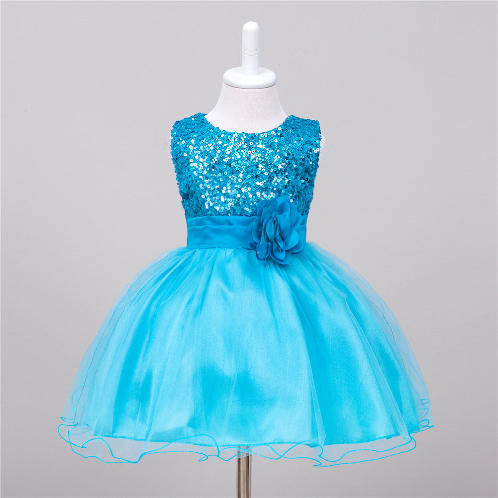 Bright blue baby sequin dress with a tulle skirt and a matching fabric flower at the waist on a mannequin.