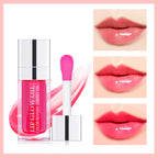 Cherry lip oil in a square clear bottle with a pink applicator, shown with glossy, tinted lip swatches.