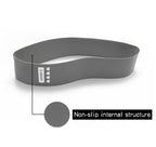 Gray "X-Heavy" resistance booty band with textured, non-slip internal material for gym and fitness training.