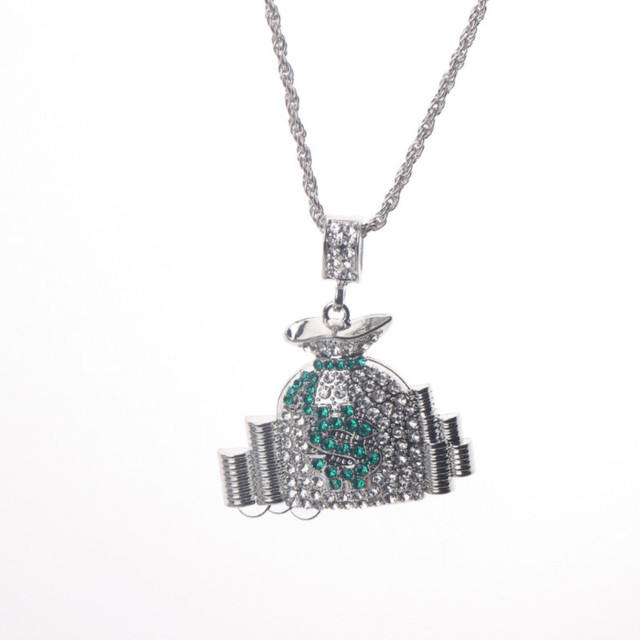 Silver-tone hip-hop money bag pendant necklace encrusted with clear and green crystals on a rope chain.