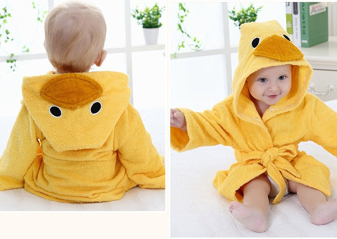 Yellow hooded cotton baby bathrobe featuring a cute duck face design with a beak and eyes. Soft, absorbent fabric.