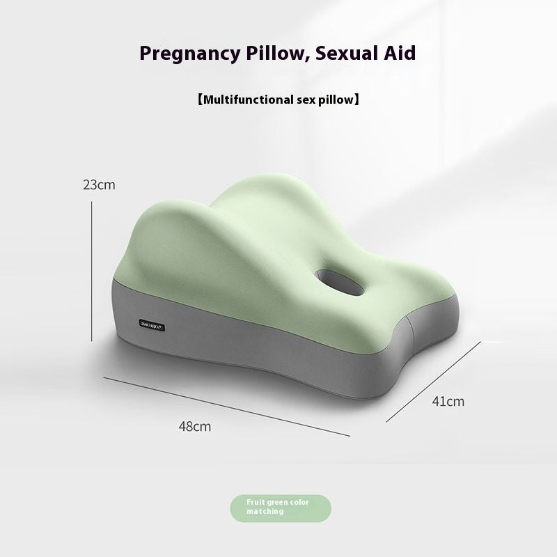 Mint green and grey contoured foam support cushion for positioning with a central cutout, labeled as a sleep aid.