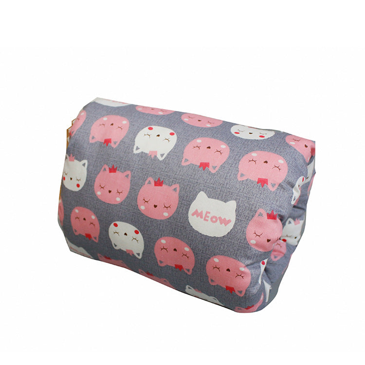 Grey cotton arm nursing pillow featuring a repeating pattern of cute pink and white cat faces and the word "MEOW."