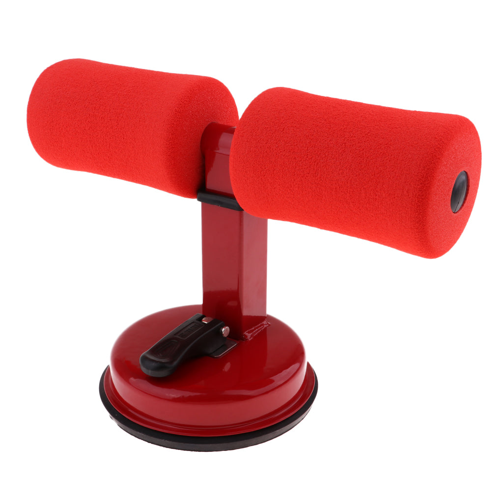 Red sit-up bar trainer with two foam-padded foot supports and a suction cup base with a locking lever.