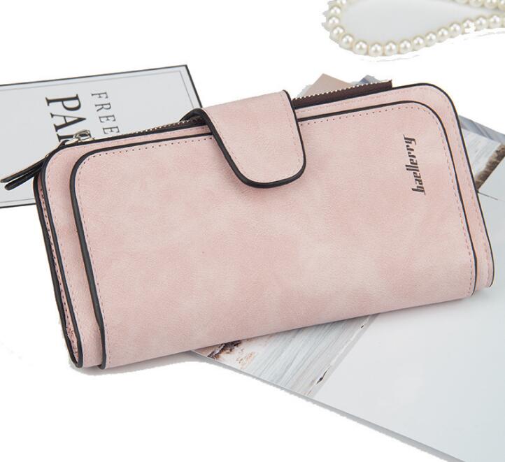 Dusty pink faux leather wallet with a snap-button flap closure and the "baellerry" brand name embossed on the front.