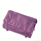 A purple, rectangular 4-in-1 travel storage bag made of smooth material, secured with light purple elastic cords.