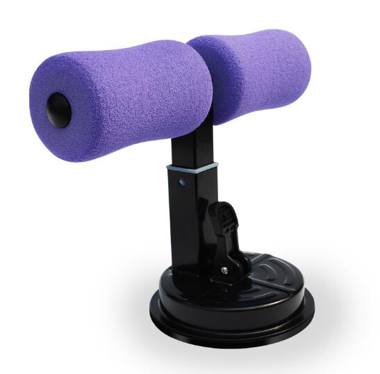 Purple foam sit-up bar trainer with a black metal frame and a sturdy suction cup base for floor mounting.