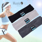 Three soft knit sports music headbands in black, grey, and charcoal, each featuring integrated Bluetooth controls.