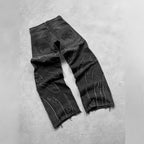 Retro black denim jeans with distressed flame patchwork, wide-leg fit, and embroidered rear pockets.