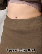 Women's brown knit loungewear set featuring a cropped top and a high-waisted ribbed skirt.