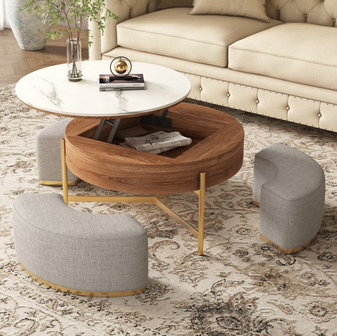 Round coffee table with lift-top marble surface, wood storage base, gold legs, and three gray upholstered stools.