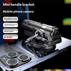 Black magnetic smartphone camera handle with a grip, Bluetooth remote, and attachment ring, shown on a mobile device.