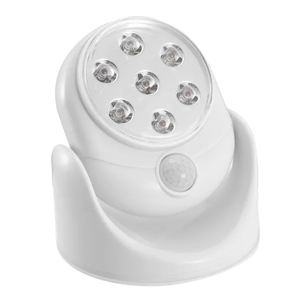 White, circular wireless LED spotlight with 7 bulbs and a built-in motion sensor on a rotating base.