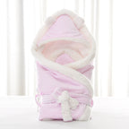 Pink plush newborn swaddle blanket with a sherpa-lined bear-ear hood and matching tie-front sash.