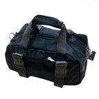 Black nylon yoga gym bag with dual top handles, zippered closure, and two adjustable front buckle straps.