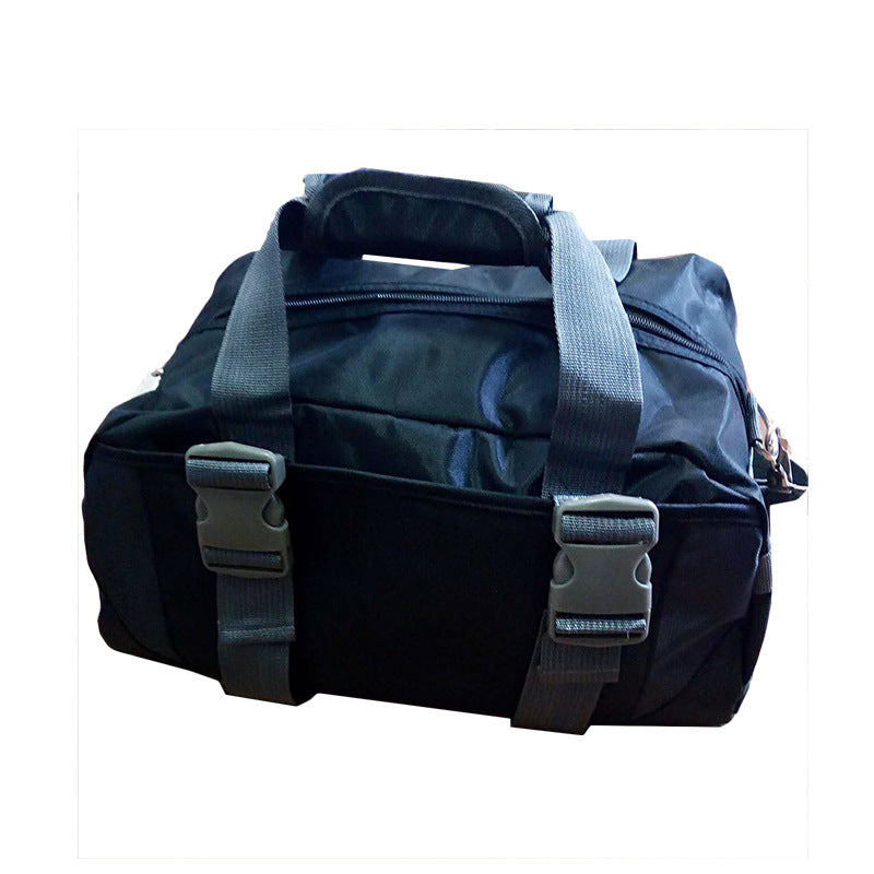 Black nylon gym bag featuring two gray buckle straps, dual carrying handles, and a top zipper closure.