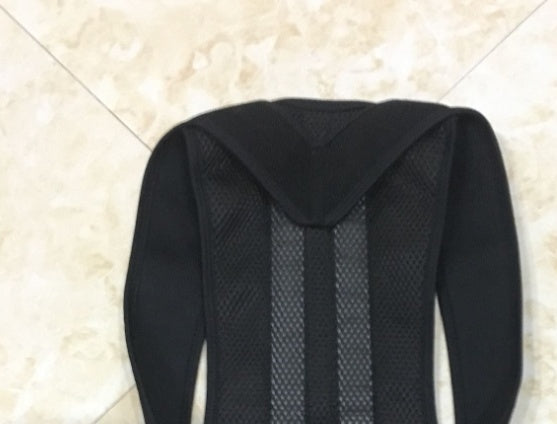 Black posture corrector brace featuring breathable mesh back panel and wide, supportive shoulder straps.