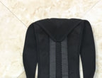 Black posture corrector brace featuring breathable mesh back panel and wide, supportive shoulder straps.