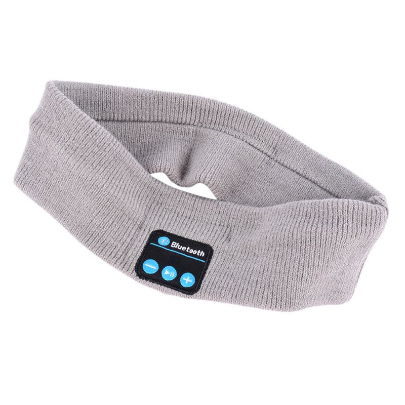 Grey knitted sports headband with integrated Bluetooth control panel featuring volume and play/pause buttons.