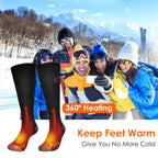 Black heated socks with 360-degree warming graphic against a background of people in winter gear enjoying the snow.