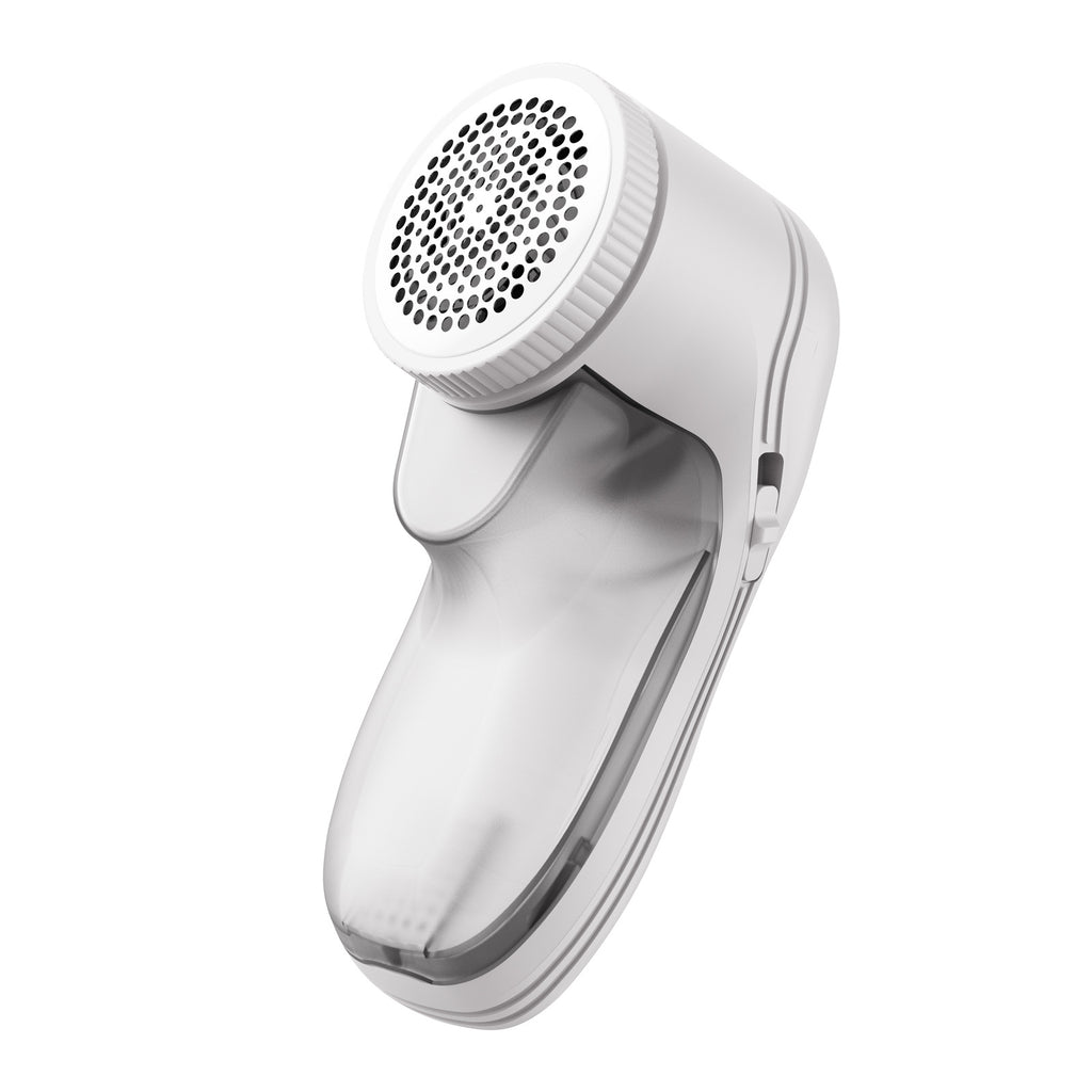 A handheld white lint remover with a circular mesh head and a translucent detachable lint collection compartment.