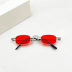 Retro hip-hop sunglasses with oval, vibrant red lenses and thin, silver-toned metal frames on a white background.