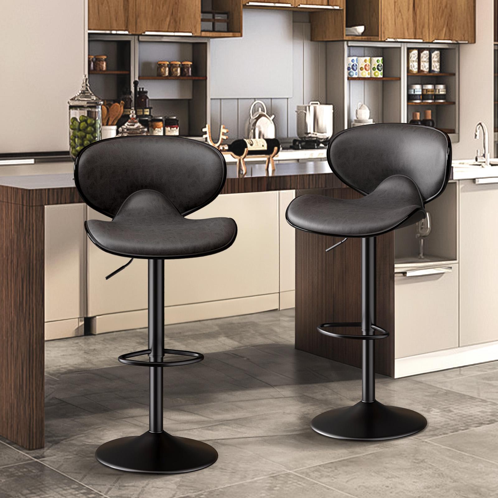 Two modern black faux leather bar stools with curved backrests, swivel seats, and adjustable height pedestals.