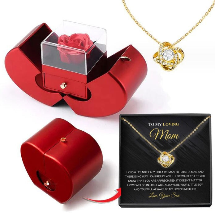 Red apple-shaped jewelry box with an eternal rose, and a gold knot necklace with a Mother’s Day message gift box.