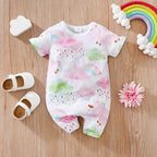 White baby romper with watercolor rainbow, cloud, and raindrop print, featuring short sleeves and snap-button closure.