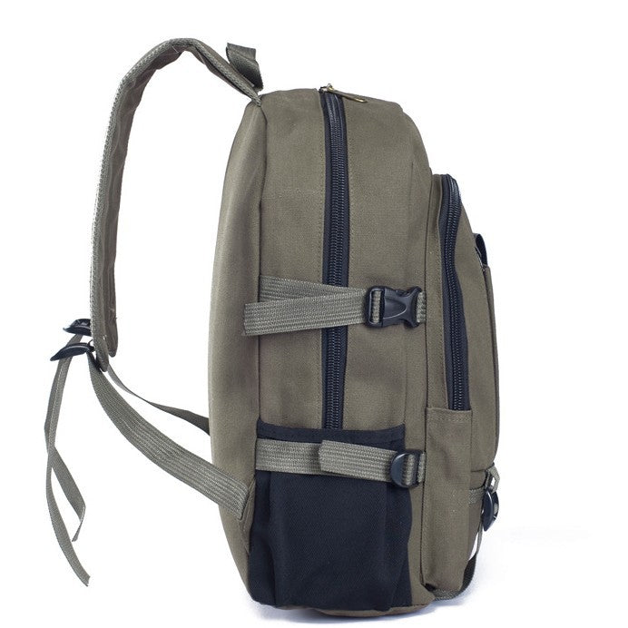 Side view of an olive green canvas student backpack with black zippers, side pockets, and adjustable buckle straps.