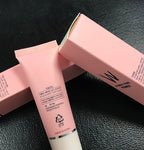 Pink W.Lab Airfit Pore Primer tube and box featuring black text on a textured black background. Made in Korea.