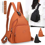 Orange and black waterproof nylon chest bags featuring multiple zippered pockets, adjustable straps, and side buckles.