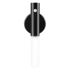 Black magnetic motion sensor LED wall light with a frosted white cylindrical shade on a circular mounting base.
