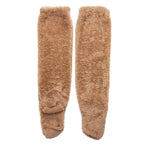 A pair of plush, tan fuzzy leg warmers made from soft, shaggy fabric against a white background.