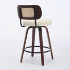 Walnut swivel bar stool featuring a beige upholstered seat, rattan cane back, and black metal footrest on wood legs.