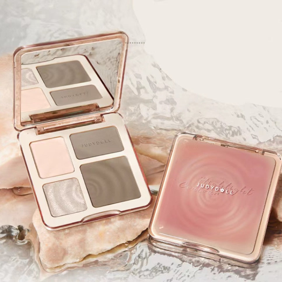 Judydoll all-in-one contour palette with matte shades and highlighter in a rose gold mirrored compact.