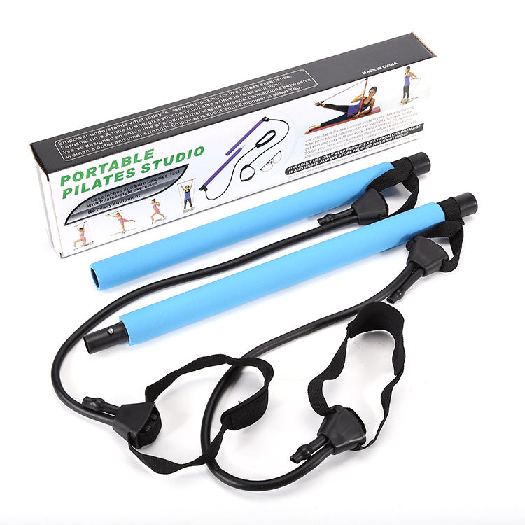 Portable Pilates studio set with a light blue foam-covered workout bar and black resistance bands with foot loops.