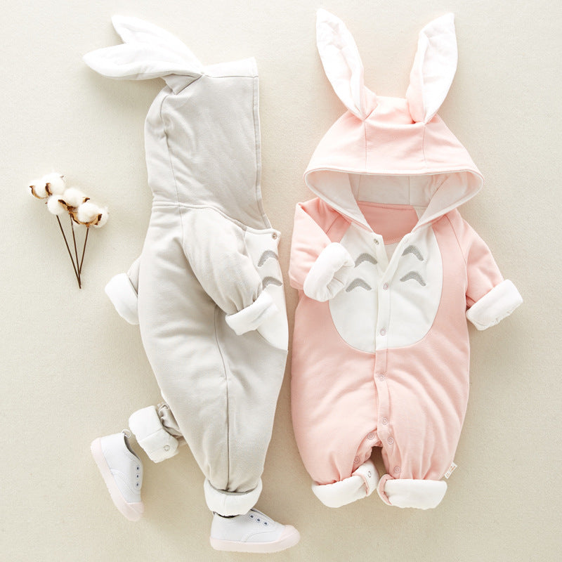 Two baby jumpsuits in gray and pink with bunny-ear hoods, front snaps, and Totoro-style chest patch. Soft cotton blend.