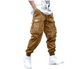 Brown, relaxed-fit cargo pants with side pockets, drawstring waist, and elastic cuffs in a street-style design.