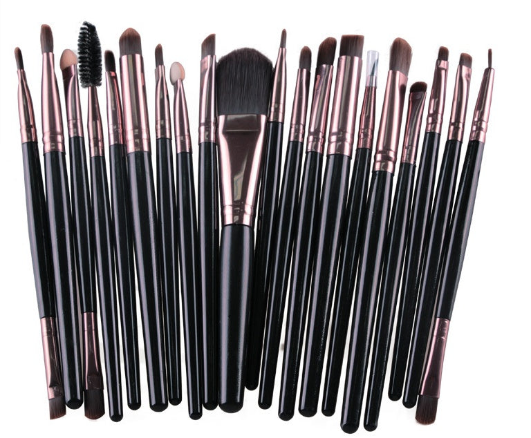 A set of Digitaldistribution375 makeup brushes with black handles, rose-gold ferrules, and various soft-bristled heads.