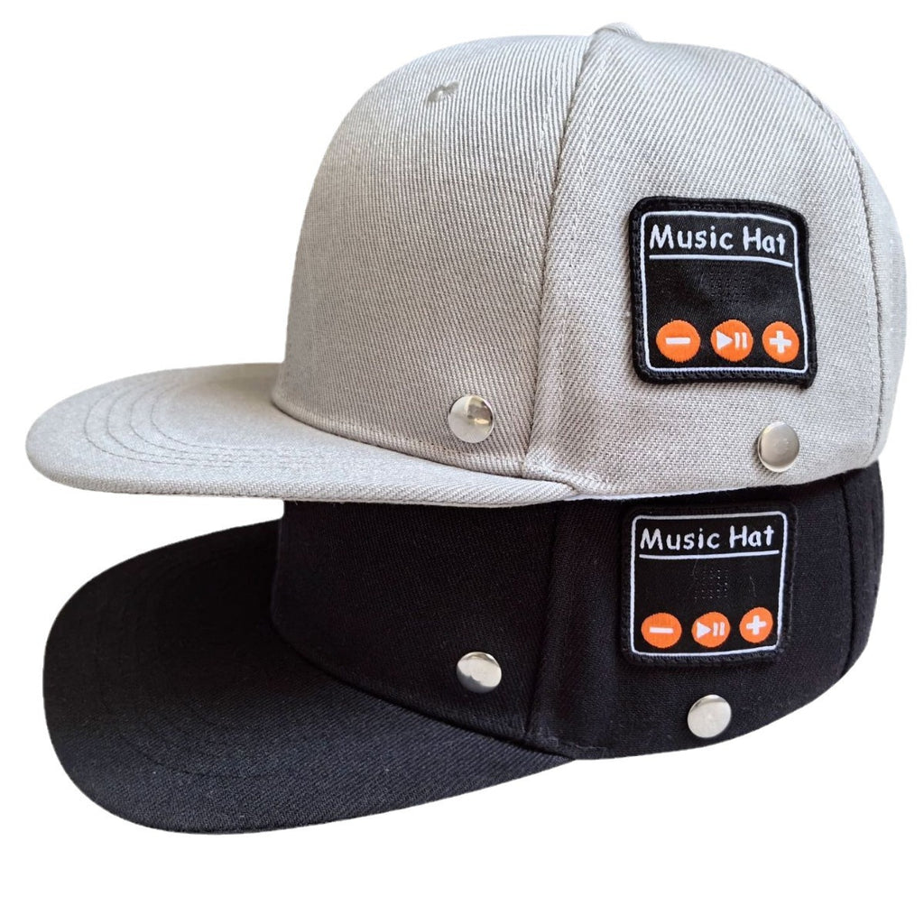 Grey and black baseball caps with side "Music Hat" Bluetooth control panels featuring playback buttons and silver rivets.
