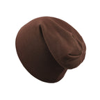 A solid dark brown, soft cotton newborn beanie cap with a slouchy, unstructured fit against a white background.