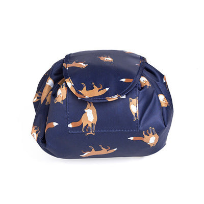 Navy blue cosmetic bag with orange fox print, featuring a drawstring closure design in a soft, durable fabric.