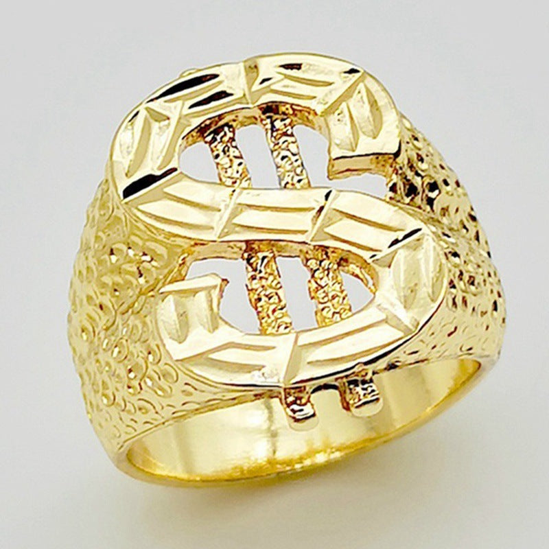 Gold-tone hip hop ring featuring a dollar sign symbol with a textured, hammered finish on a white background.