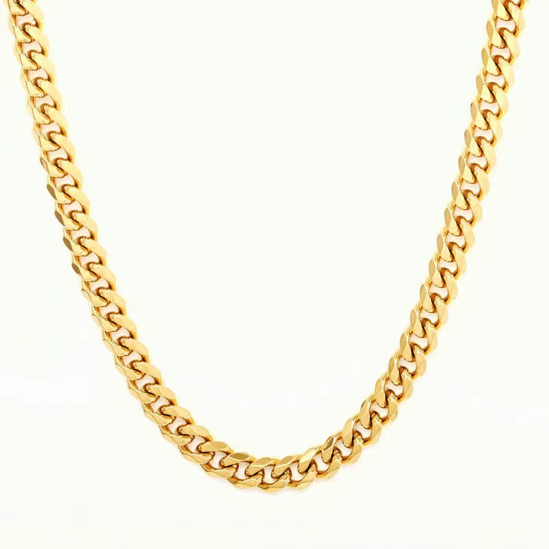 Gold-tone Cuban link chain necklace with a classic polished finish on a clean white background.